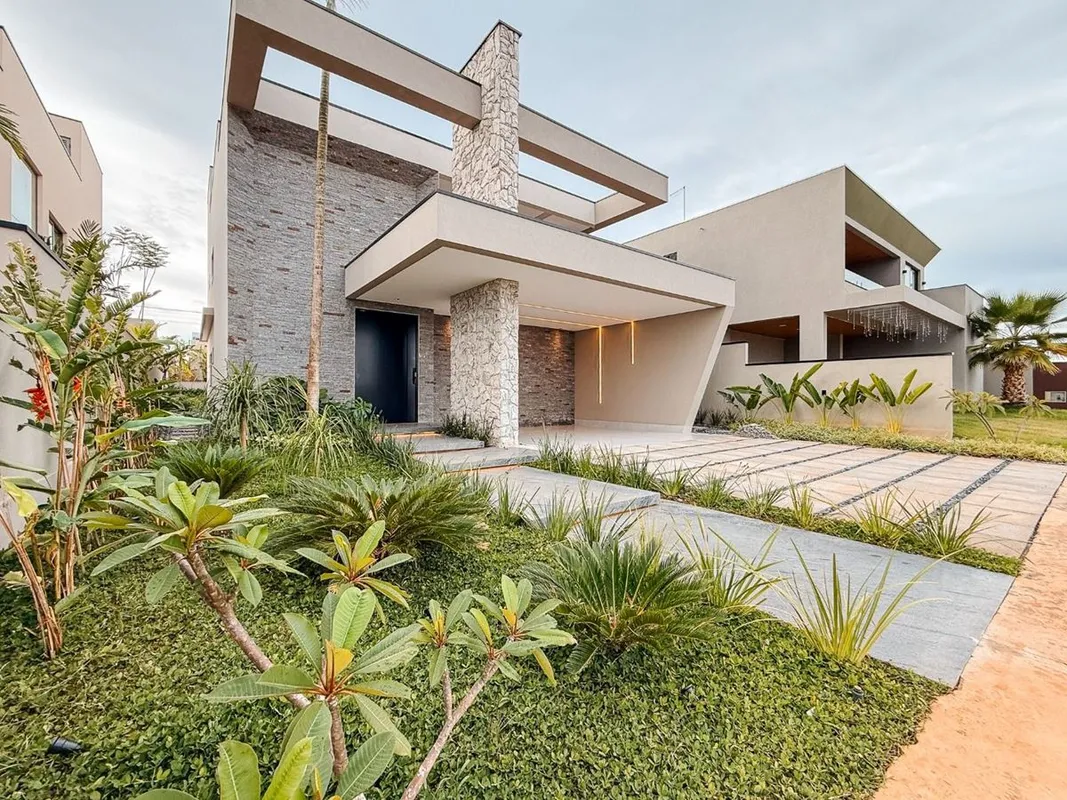 Casa Jardins Arquitetura moderna e conforto para viver bemno condomínio Condomín...